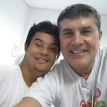 José Muniz com paciente especial, após tratamento dentário, realizado durante a Special Olympics